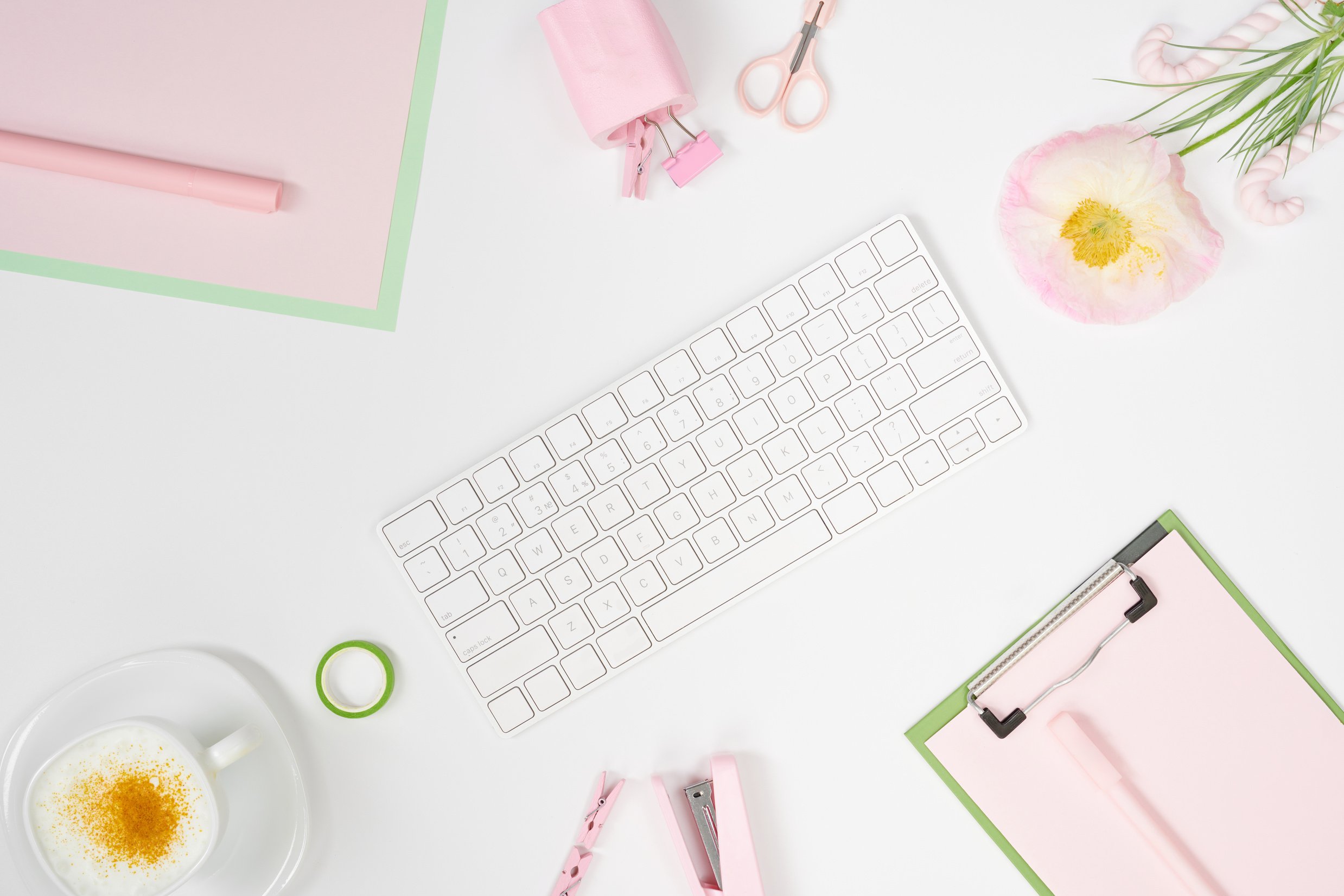 Girly workspace mockup with keyboard and stationary